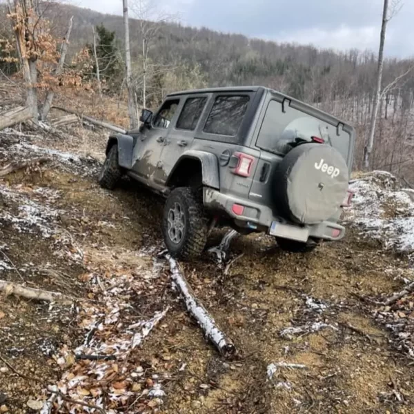 The Jeep climbs up the hard-to-pass,muddy parts of the mountains.